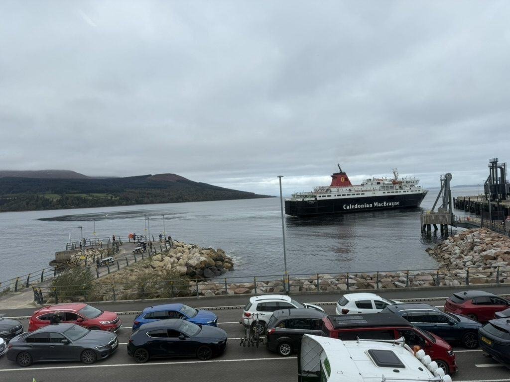 The CalMac ferry arriving at Brodick pier, Isle of Arran, with Goatfell in the background