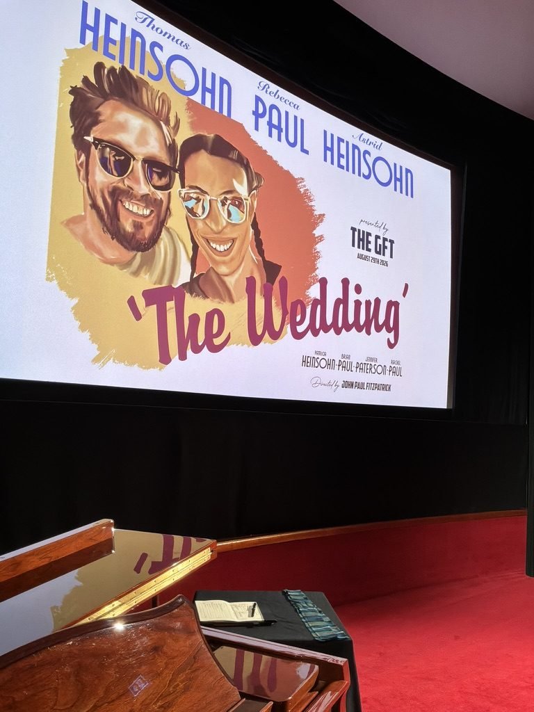 A hand-drawn vintage-style film poster on the Glasgow Film Theatre screen reading 'The Wedding', starring Thomas Heinsohn and Rebecca Paul, presented by the GFT, August 29th 2026