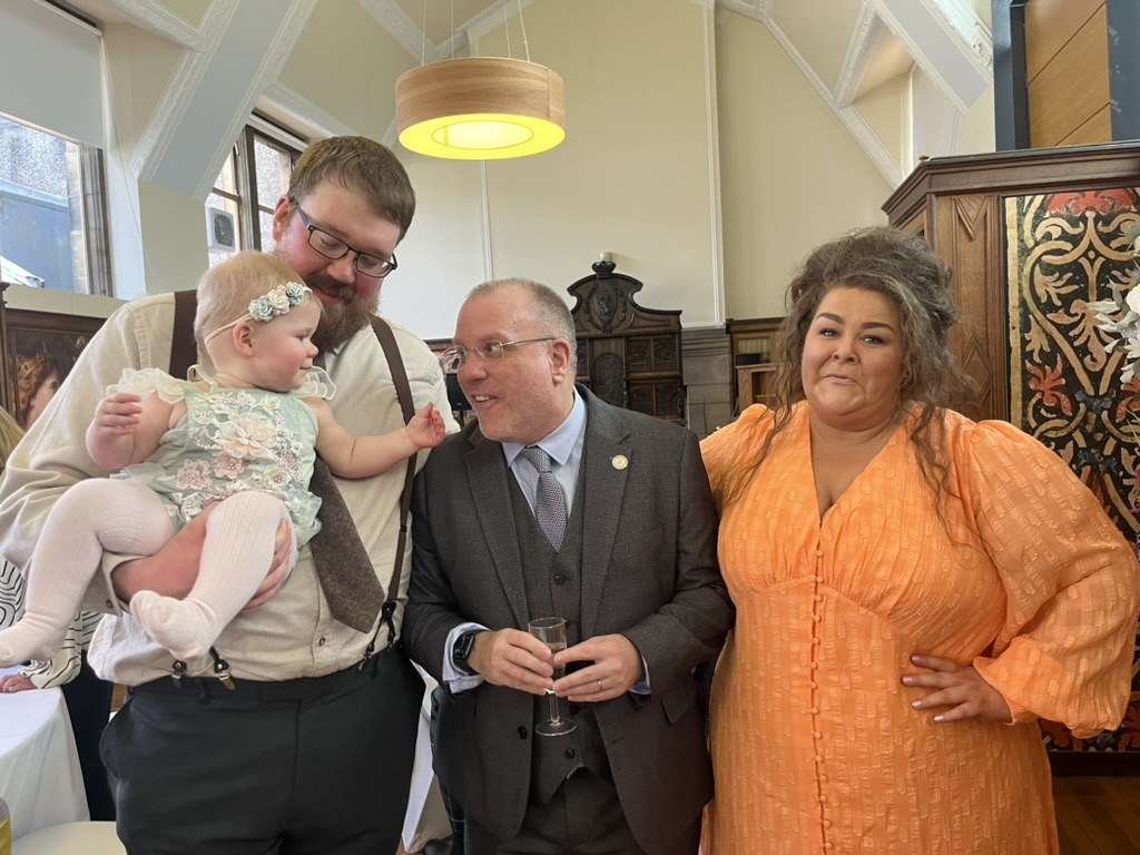 John Paul with a family celebrating their daughter's naming day at a humanist naming ceremony in Fife