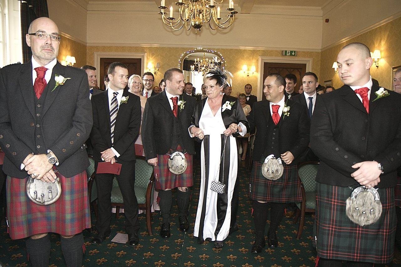 John Paul's own wedding day at Ross Priory in 2012 — the wedding party in kilts inside the priory