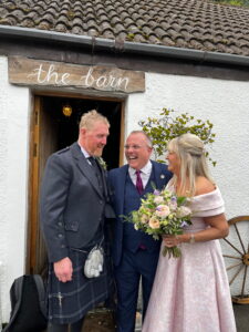 John Paul Fitzpatrick humanist celebrant with happy wedding couple